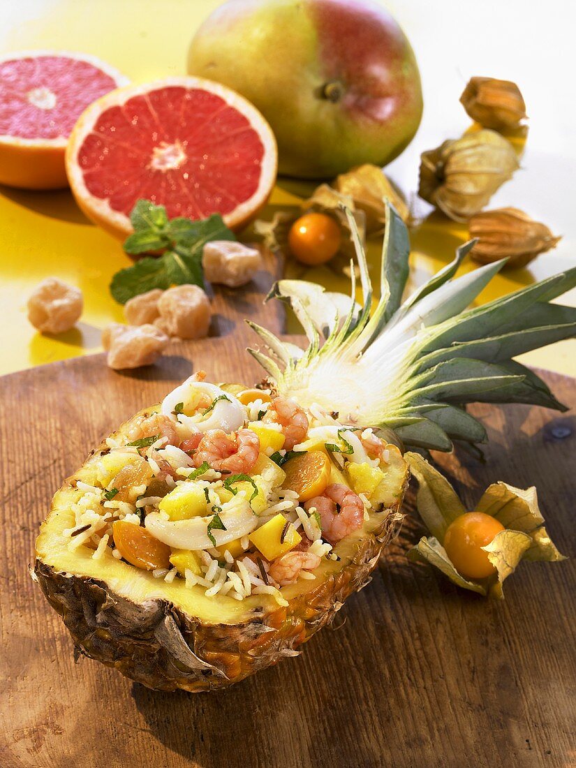 Exoctic rice salad in a hollowed out pineapple half