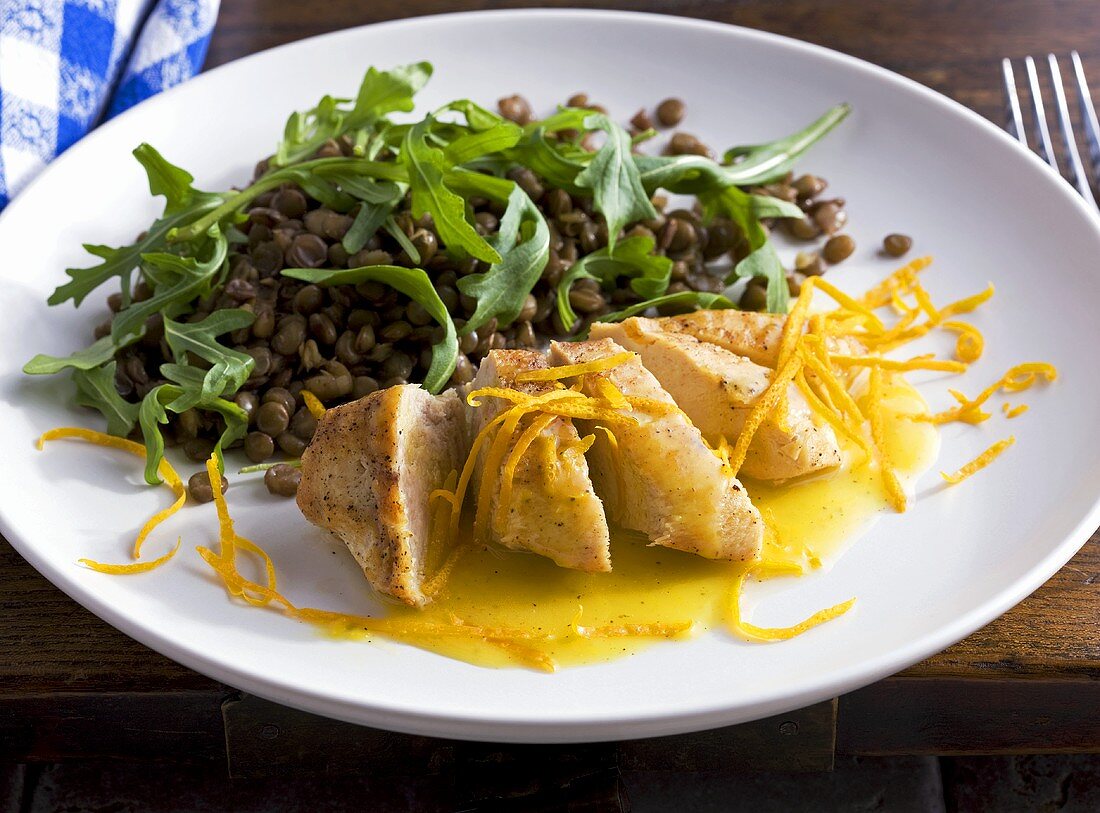 Chicken breast with orange sauce and lentil salad