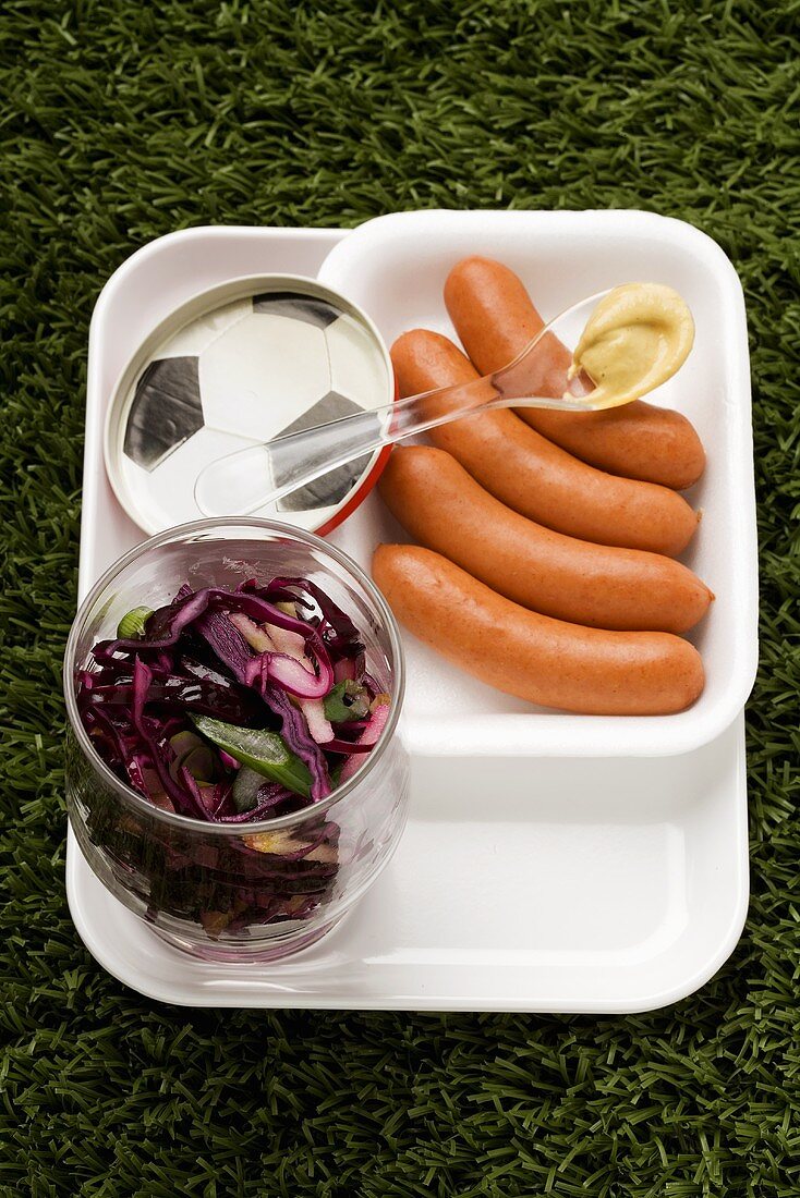 Frankfurters, red cabbages salad and mustard
