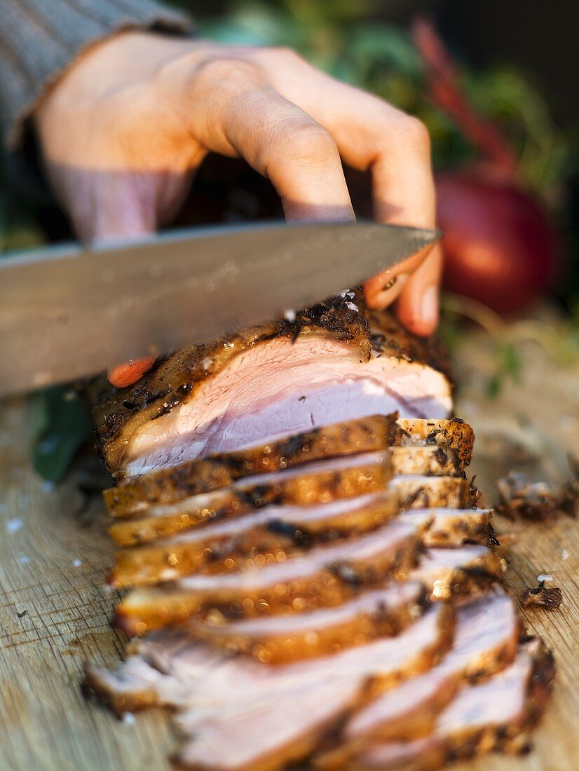 A joint of meat being sliced