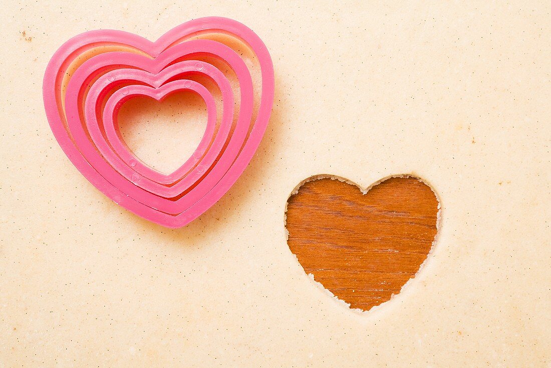 Shortbread dough with heart-shaped cutters