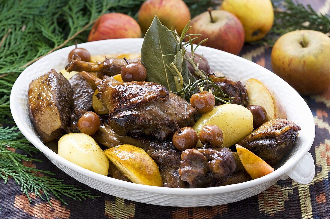 Duck stew with cherries, apples and potatoes