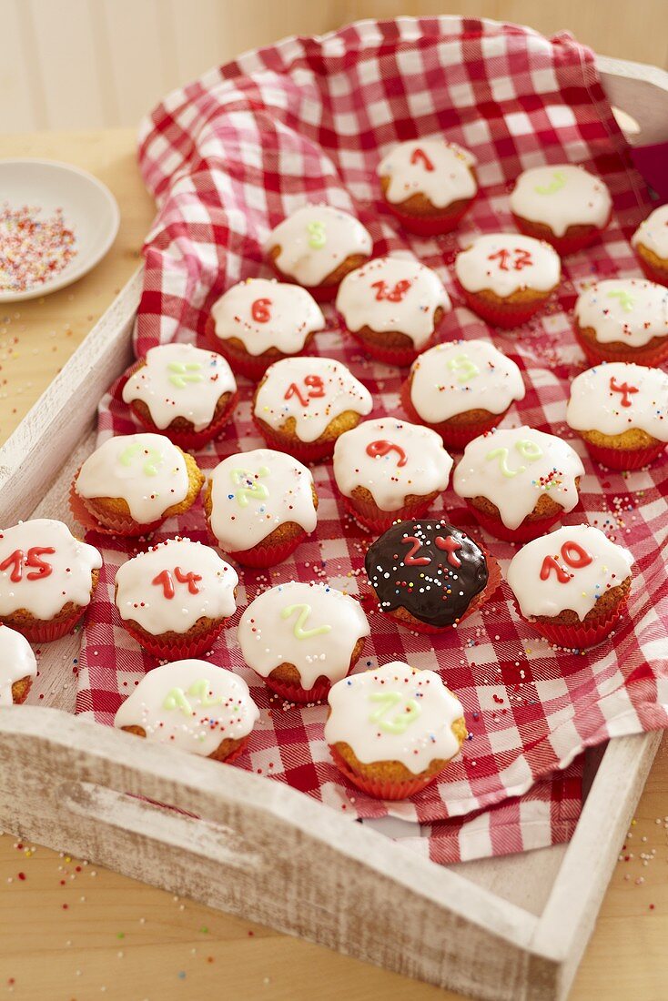 Advent calendar cupcakes on a tray