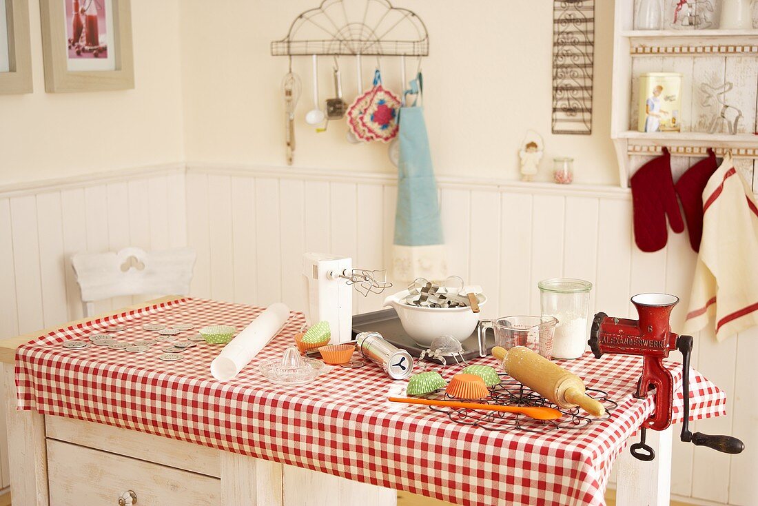 An arrangement of baking utensils on a kitchen table