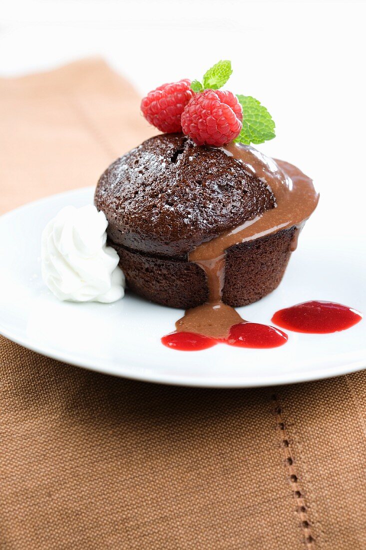 Mini chocolate cake with raspberry and chocolate sauce