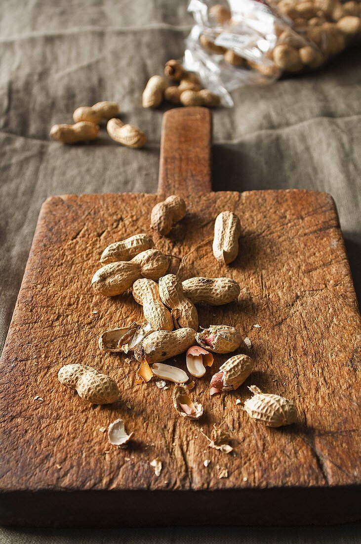 Peanuts on a chopping board