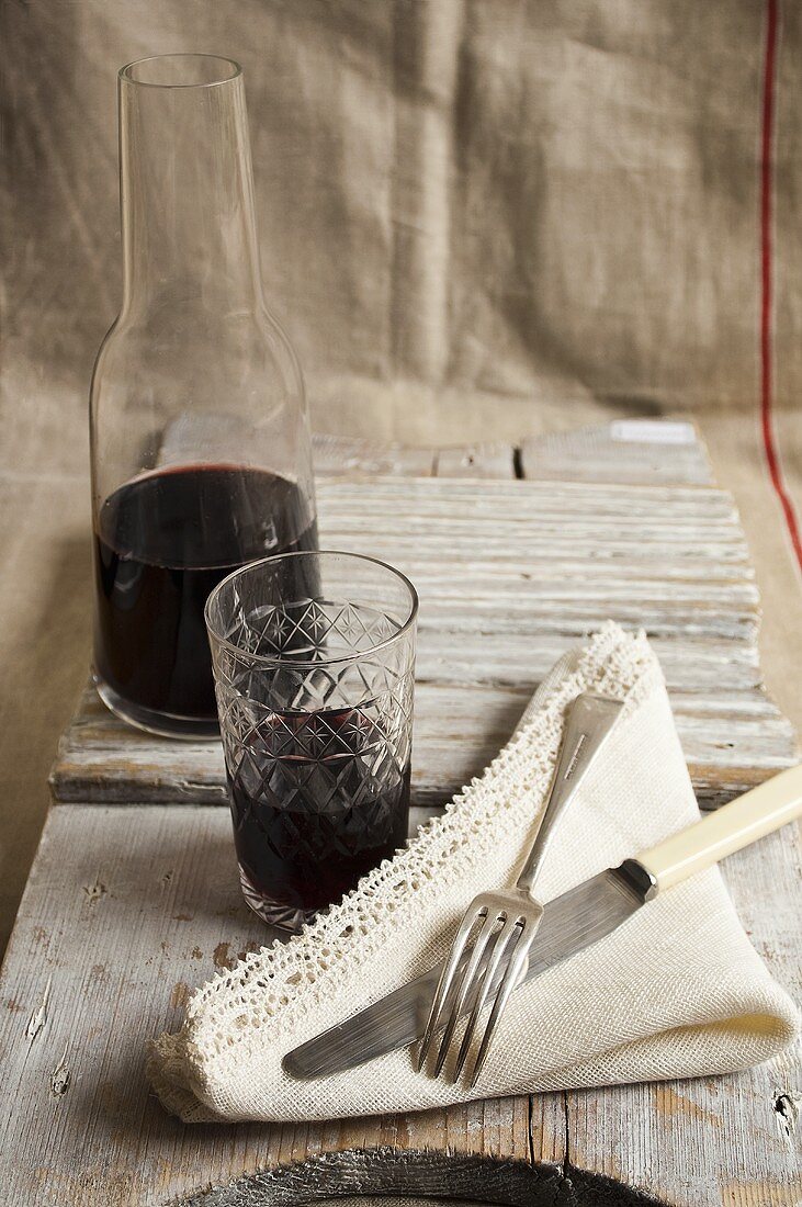 Red wine, napkins and cutlery