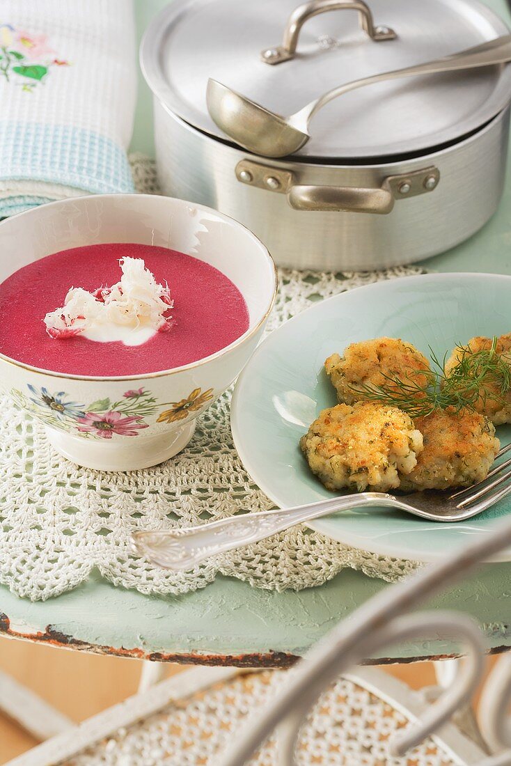 Beetroot soup with horseradish and fish cakes