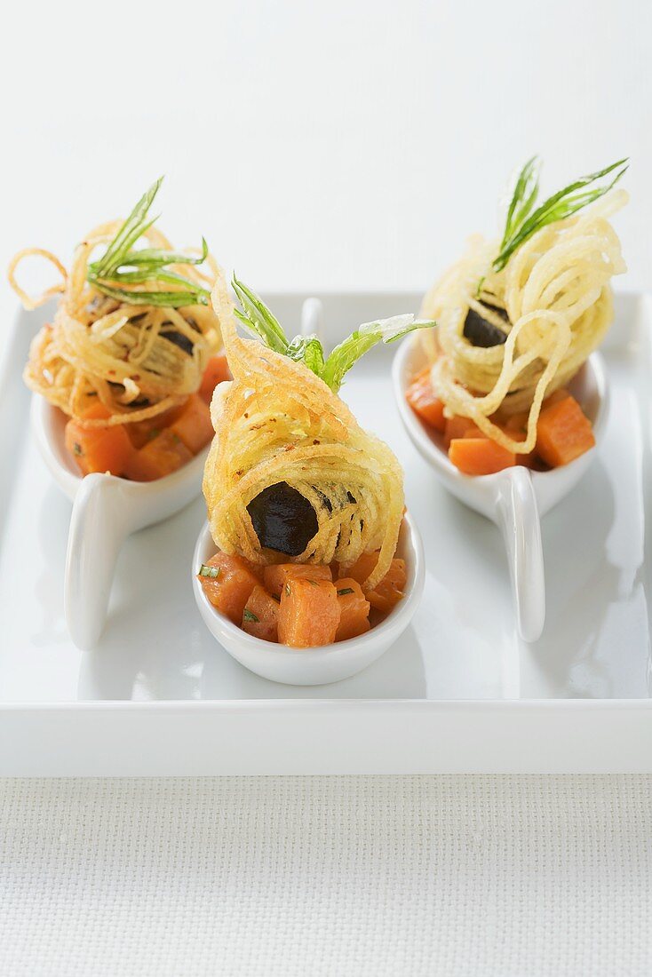 Pumpkin ragout with black pudding and fried potato slices