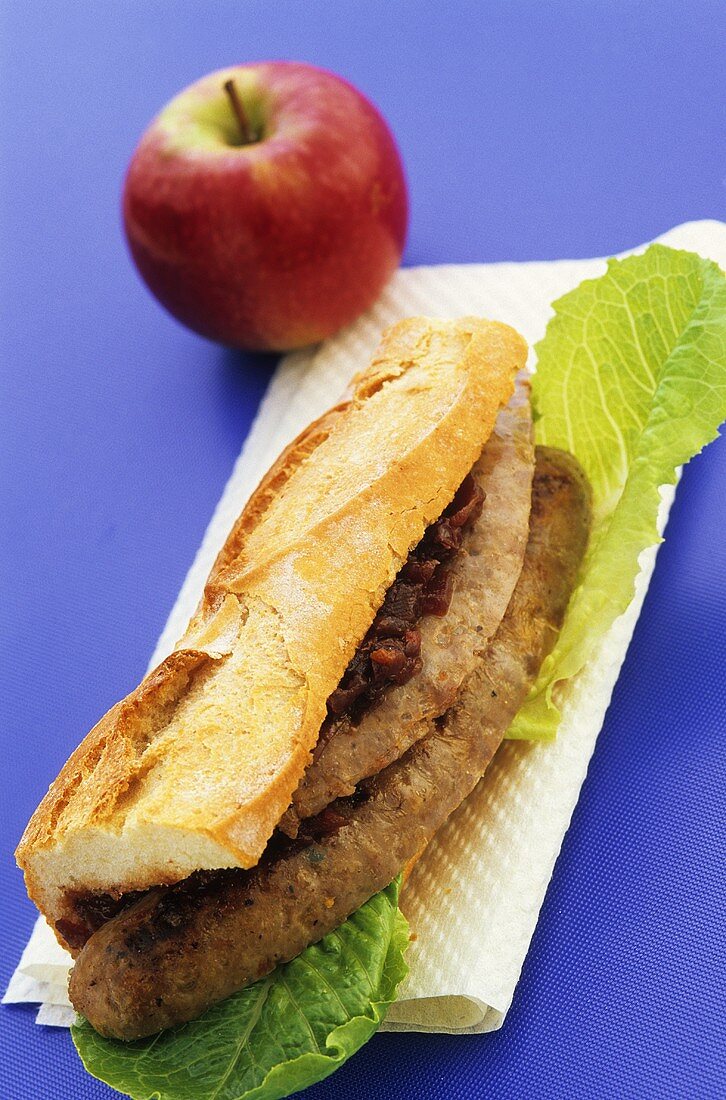 A sausage sandwich on baguette bread