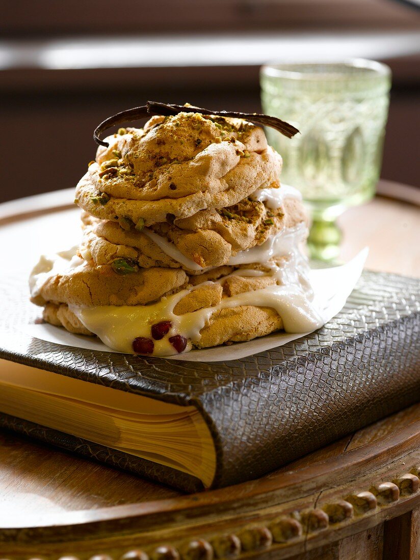 Vanilla and pistachio meringue with pomegranate seeds