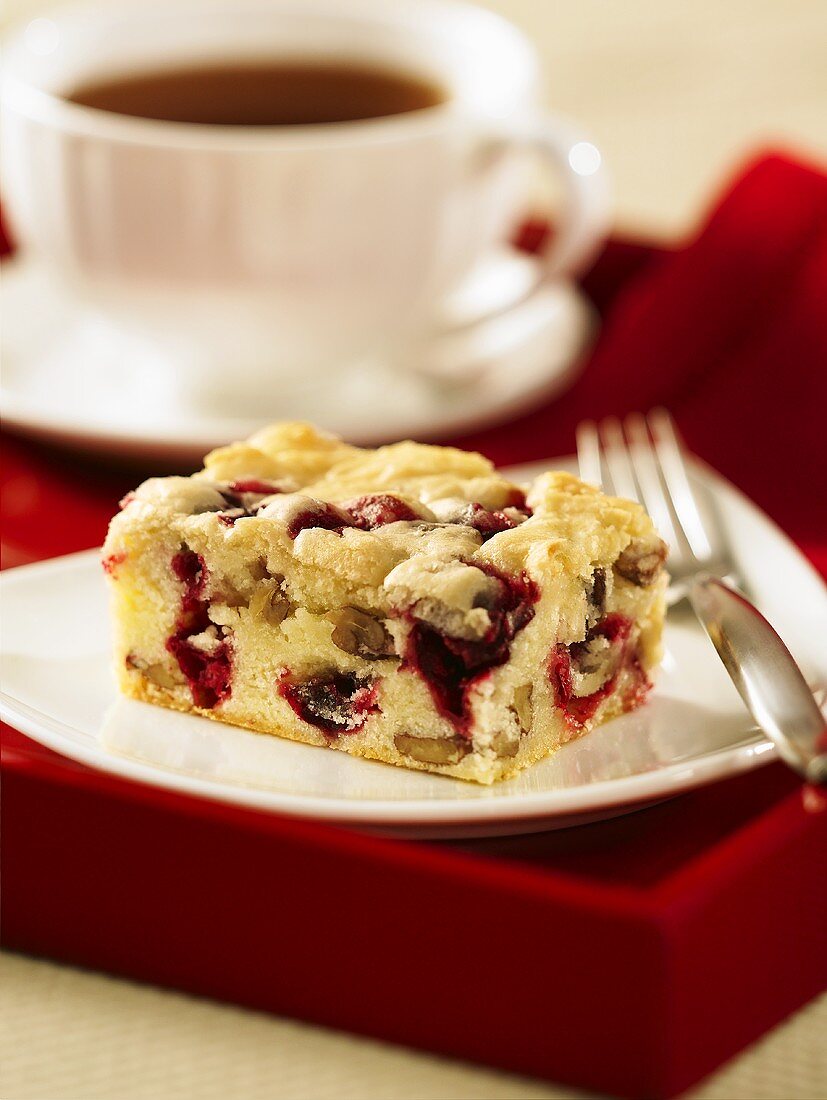 A piece of cranberry and nut cake