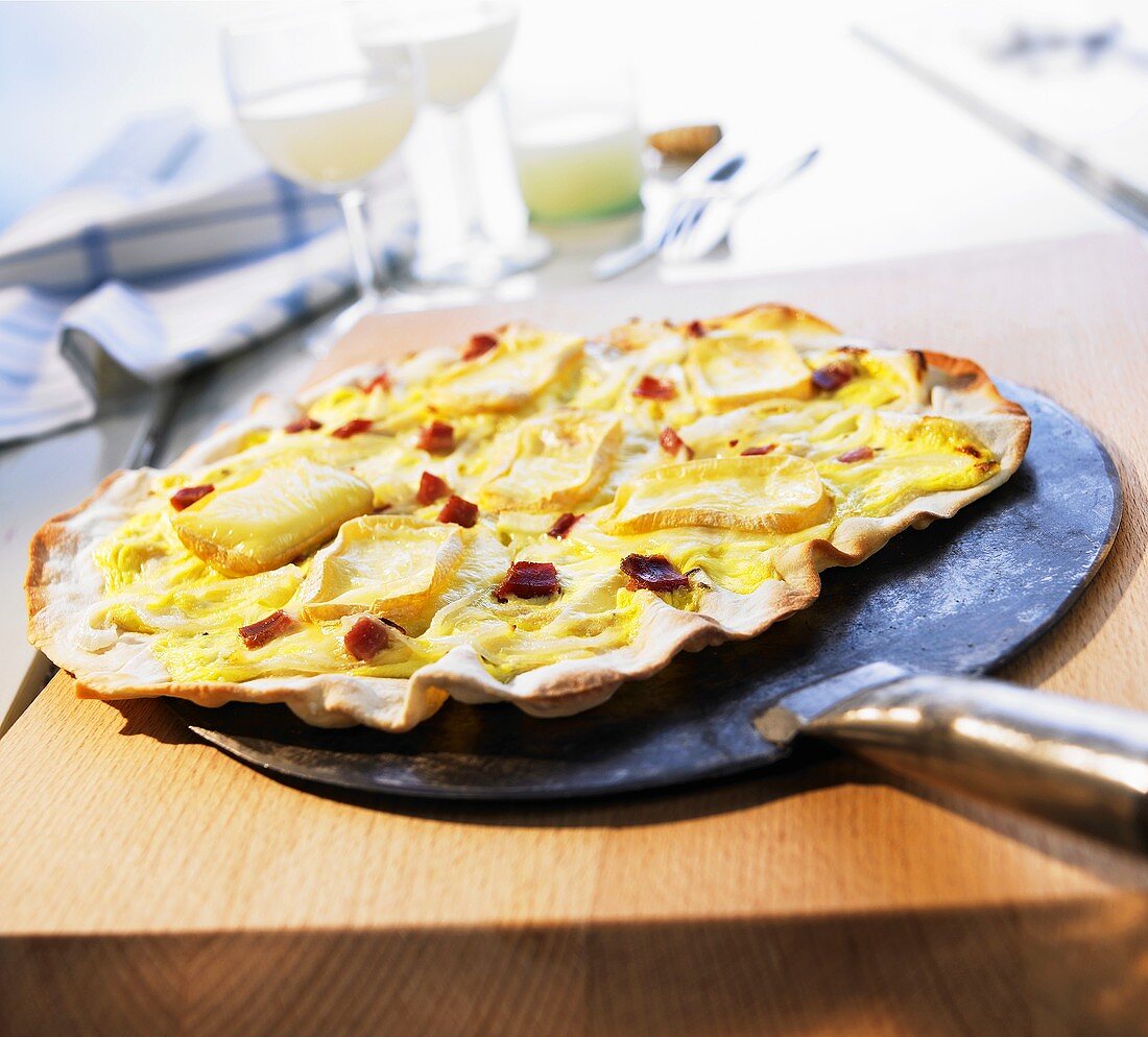 Tarte flambée with bacon and Camembert cheese