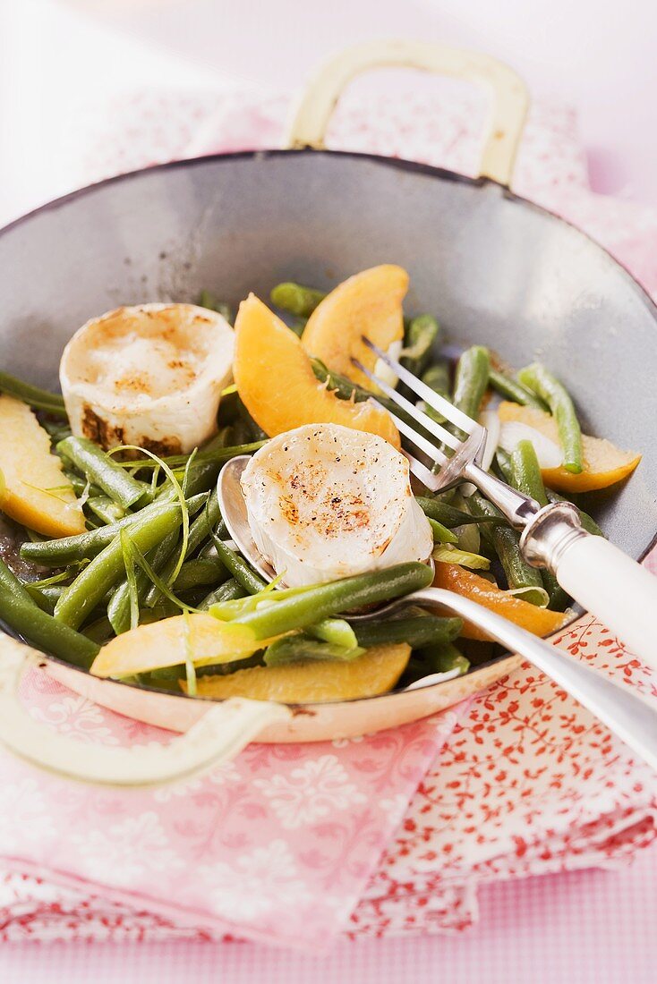 Bean salad with peaches and grilled goat's cheese