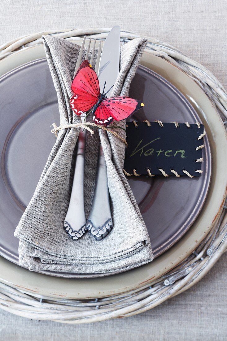 A festive place setting in grey-beige