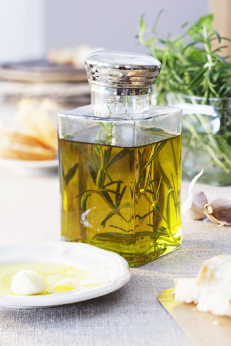 Olive oil with a sprig of rosemary