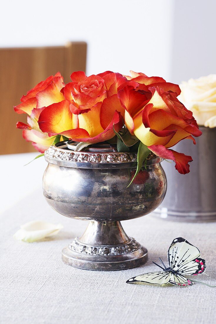 Roses in an old English silver bowl