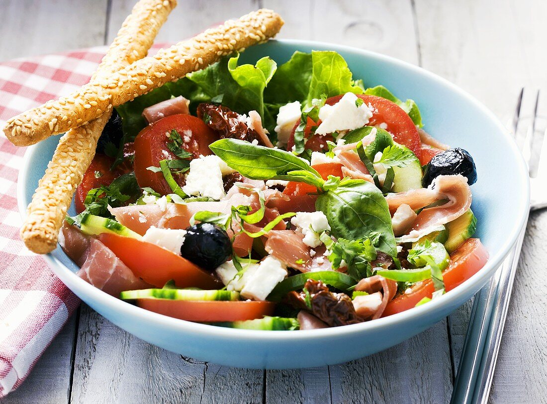 Tomato salad with smoked ham and feta