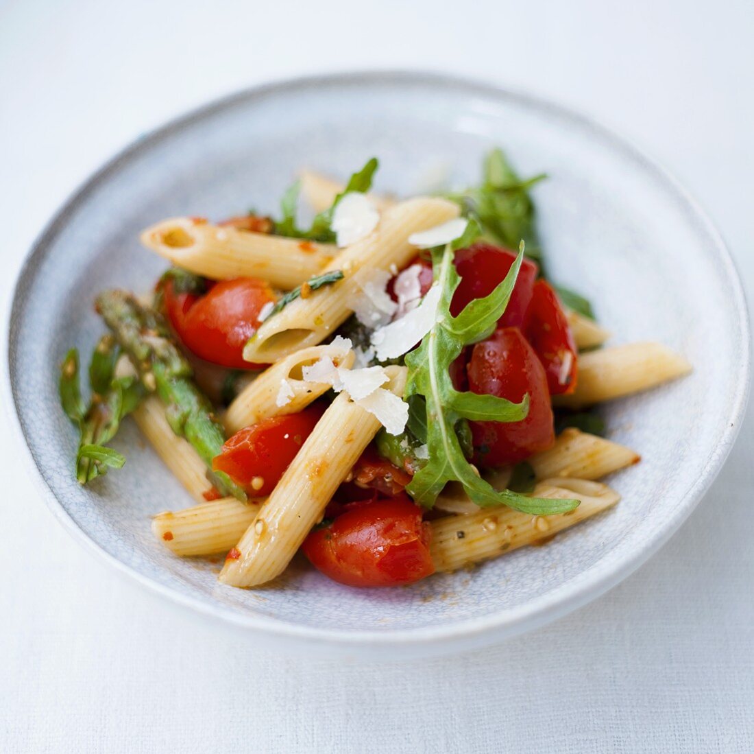 Penne with tomatoes, green beans, rocket and Parmesan