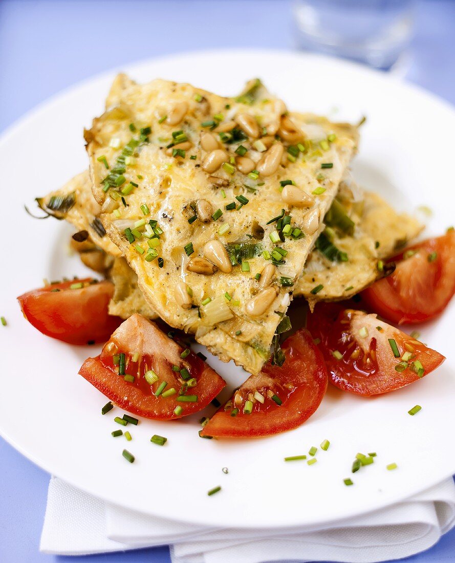 Herb omelette with pine nuts and tomatoes