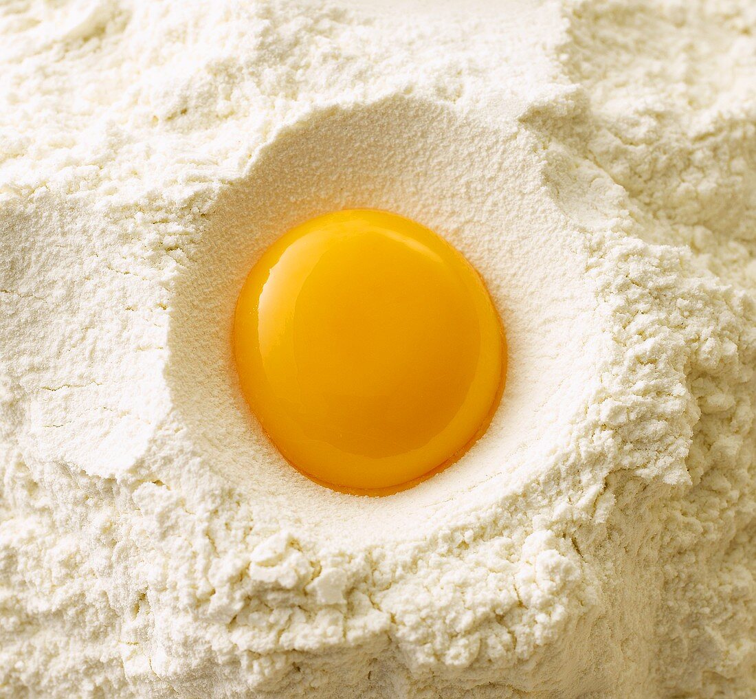 Egg yolk on flour (overhead view)
