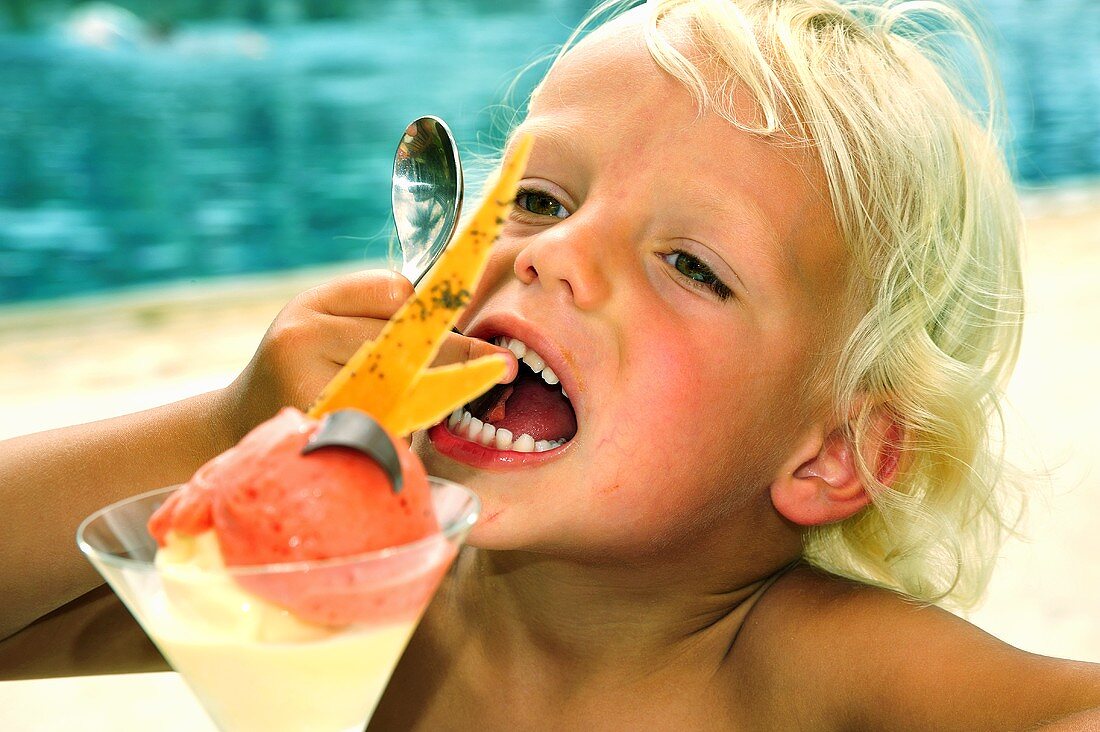 Child eating ice cream sundae