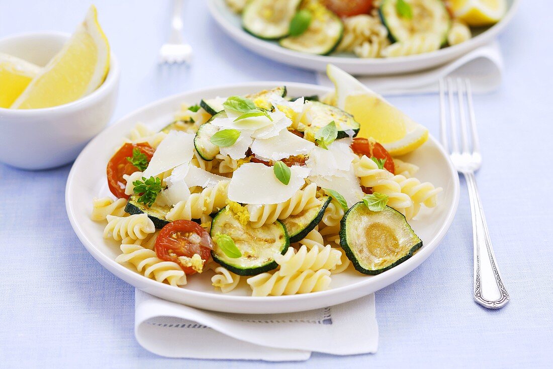 Pasta salad with courgettes, tomatoes, herbs and Parmesan