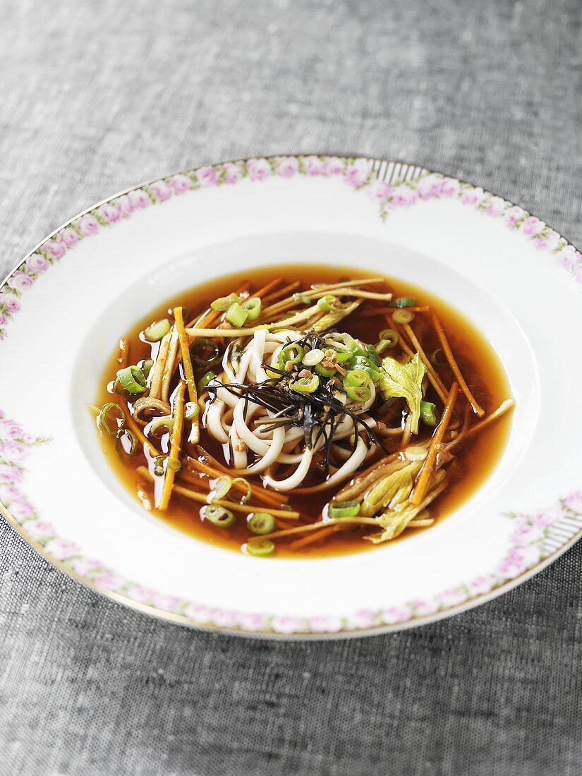 Miso soup with carrots, noodles and leeks