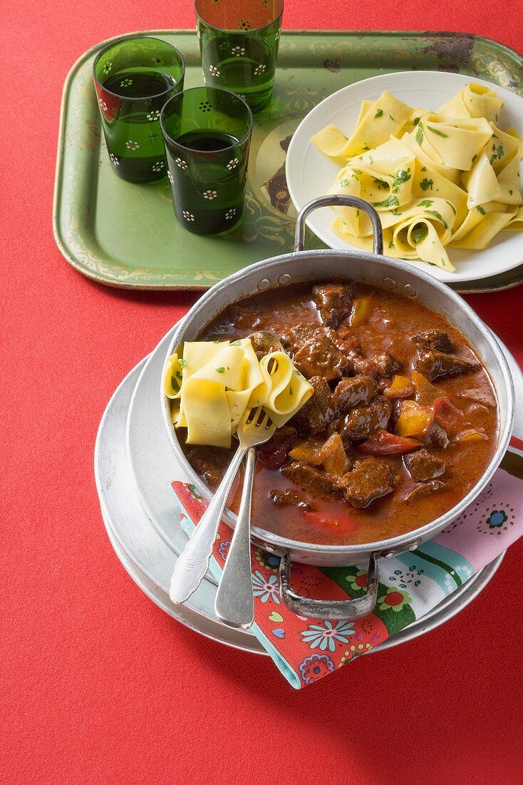 Beef goulash with peppers and broad ribbon pasta