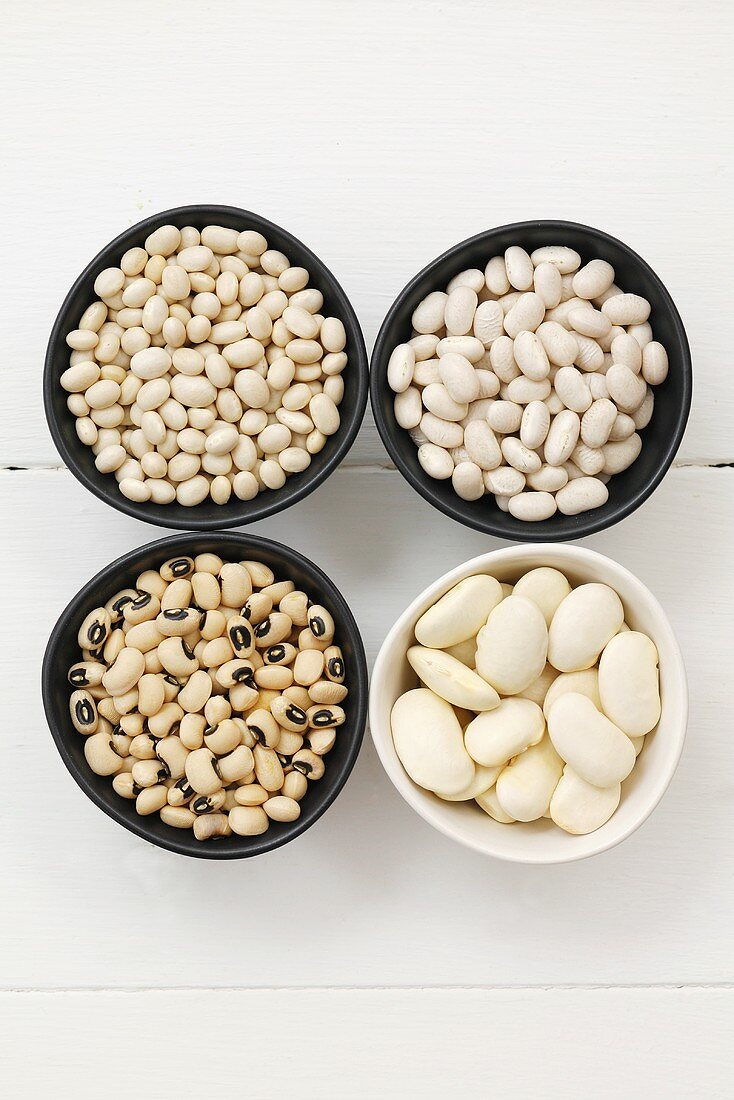 Various types of beans in small dishes