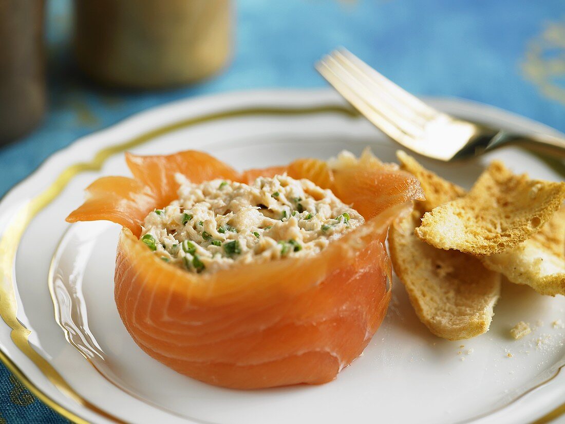 Fish salad in a smoked salmon basket