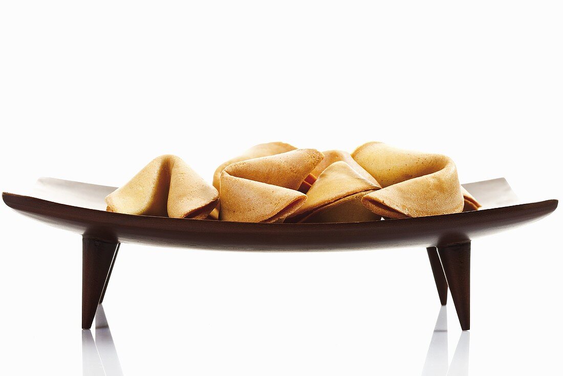Fortune cookies on wooden platter