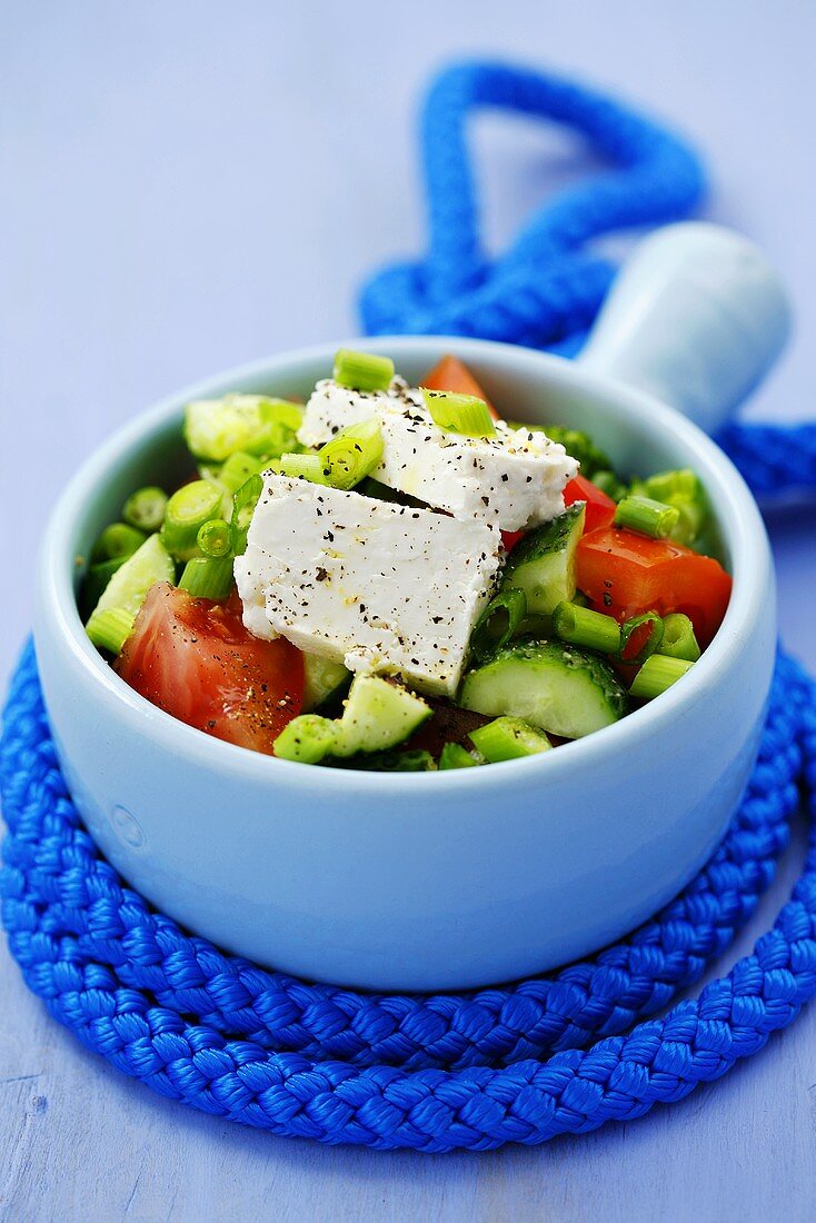 Cucumber and tomato salad with sheep's cheese