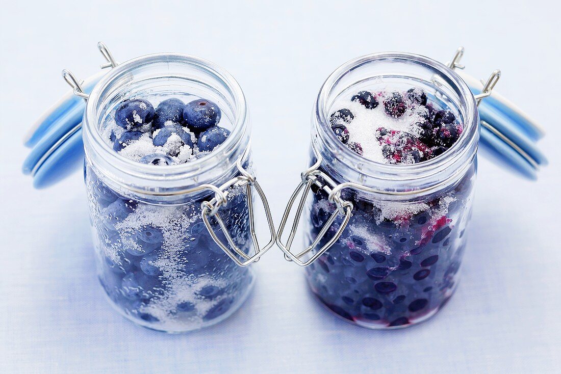 Sugared blueberries and bilberries in preserving jars