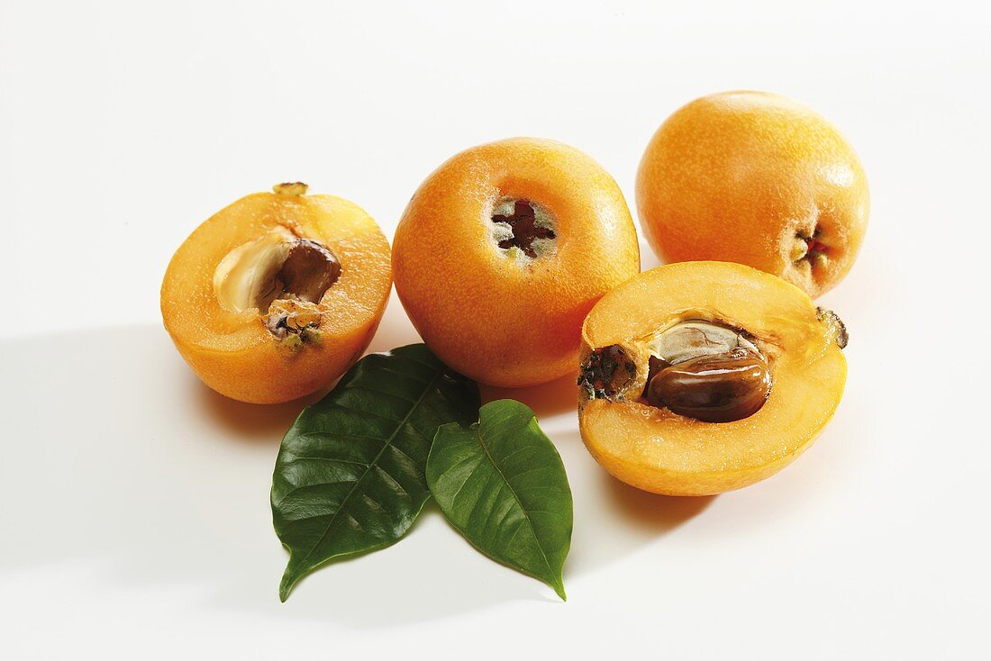 Medlars, whole and halved