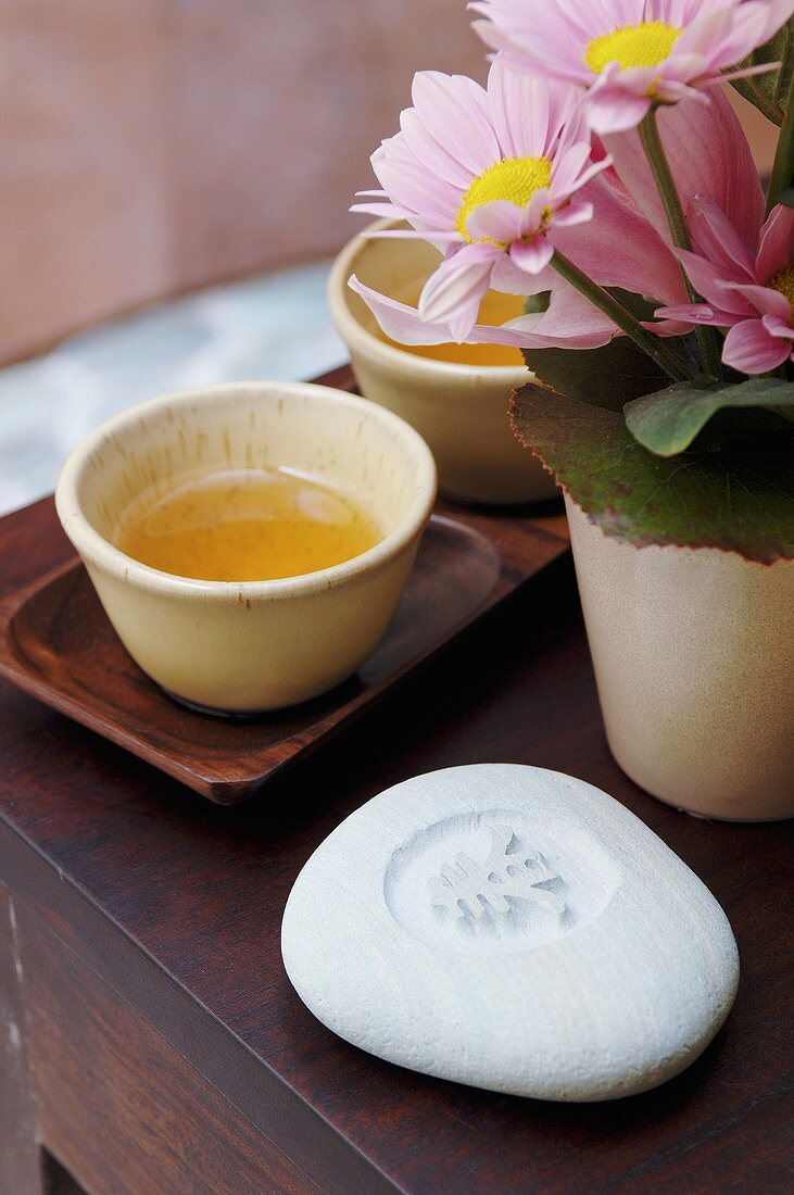 Soap, flowers and bowls of tea