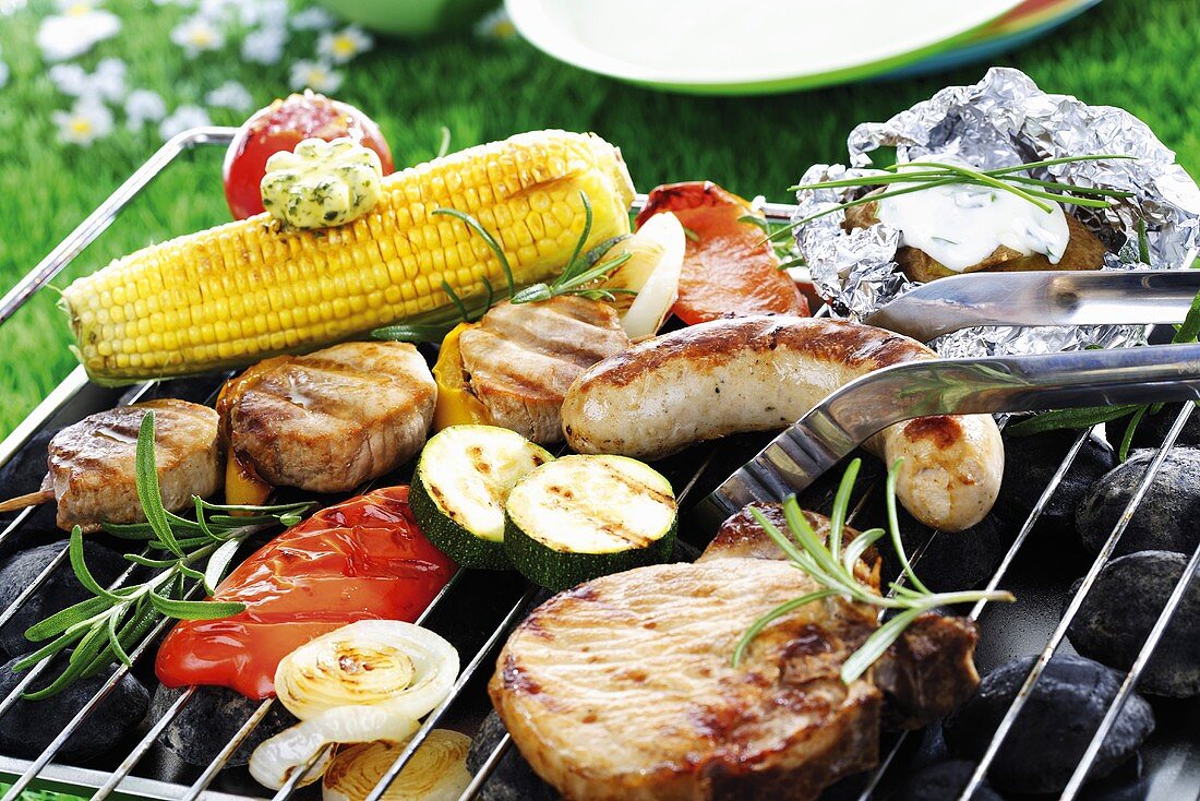Meat, sausage and vegetables on barbecue