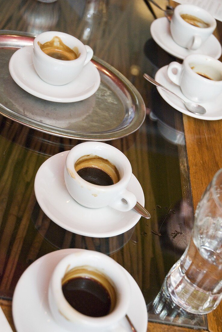 Several cups of espresso on table