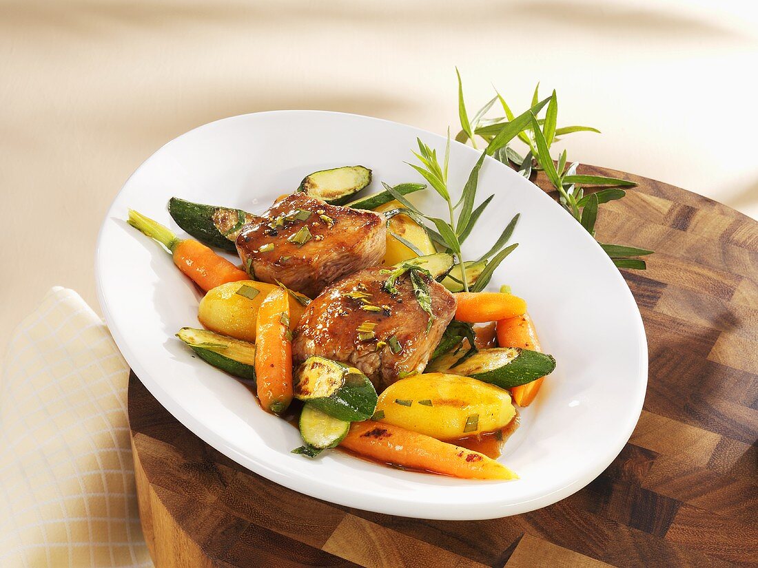 Noisettes of lamb with tarragon and vegetables