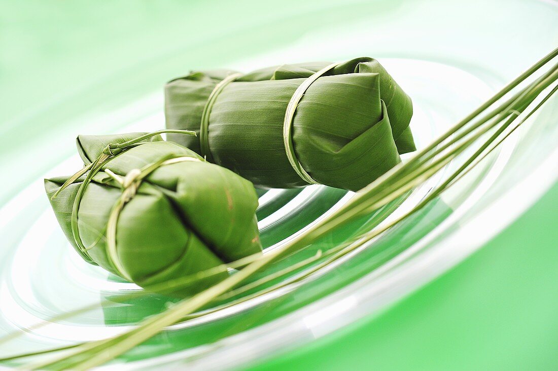 Banana leaves with rice and banana stuffing