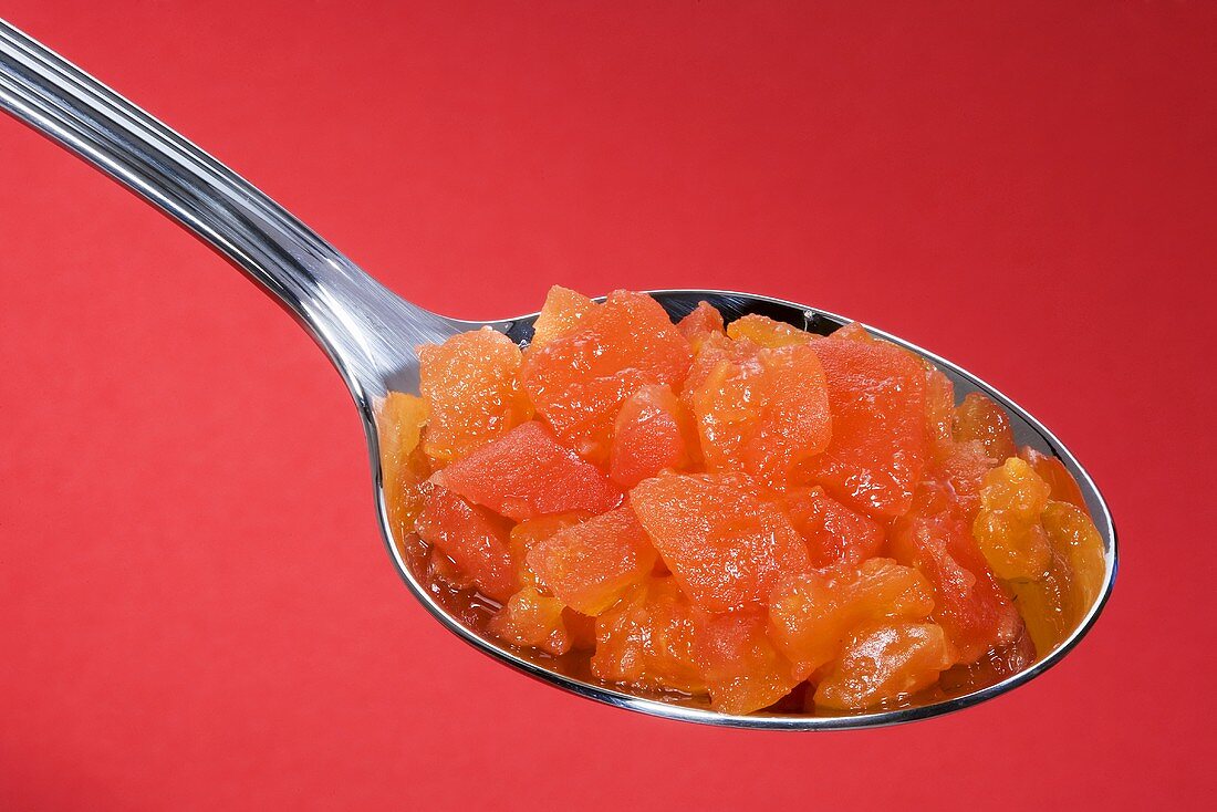 Diced tomato on spoon