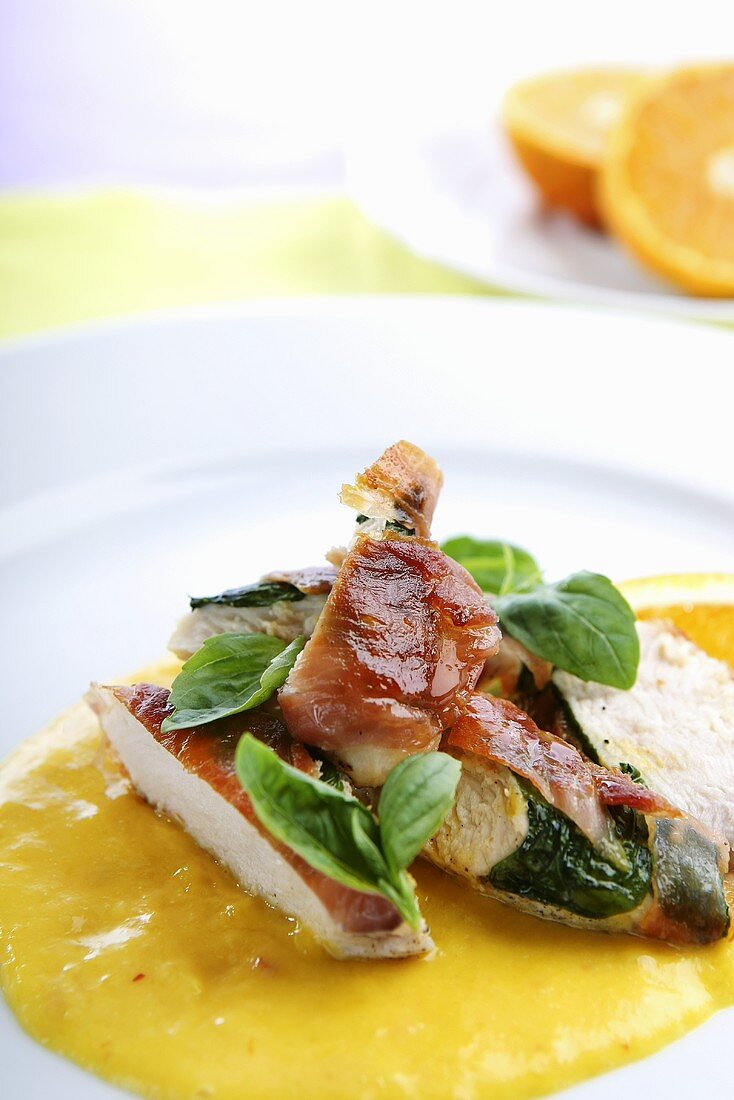 Chicken breast with mango sauce and basil