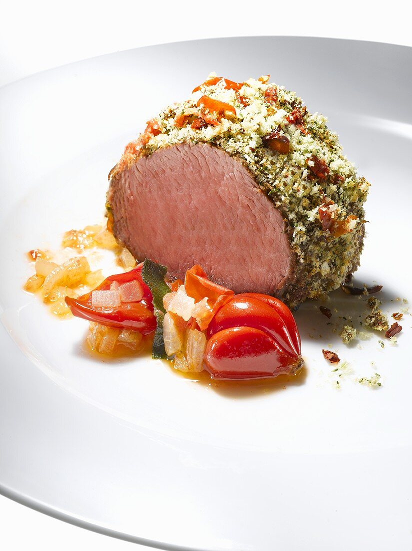 Pork fillet with herb crust and tomato