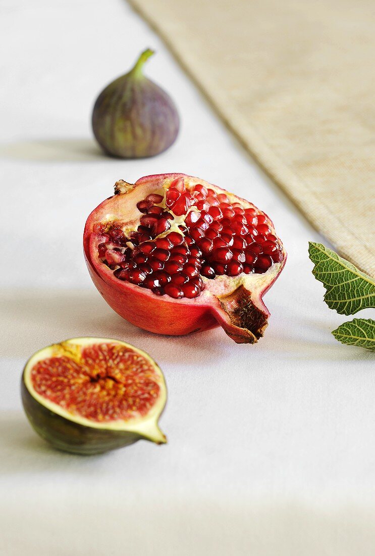 Half a pomegranate and fresh figs