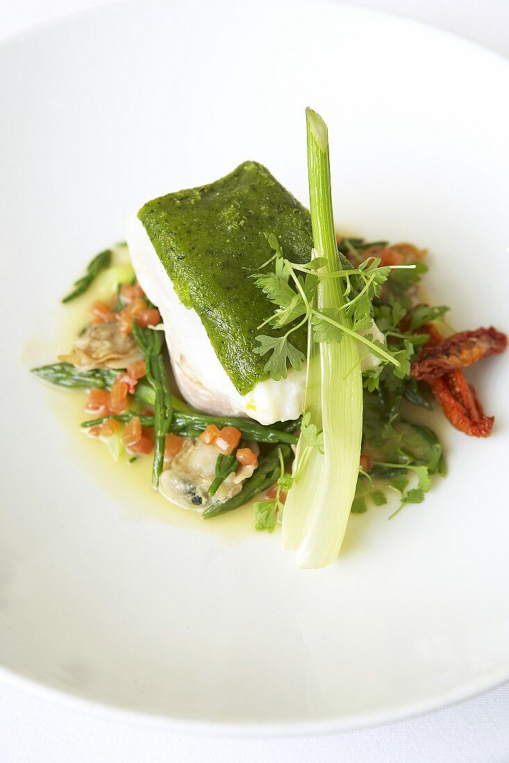 Halibut with herb crust on spring vegetables