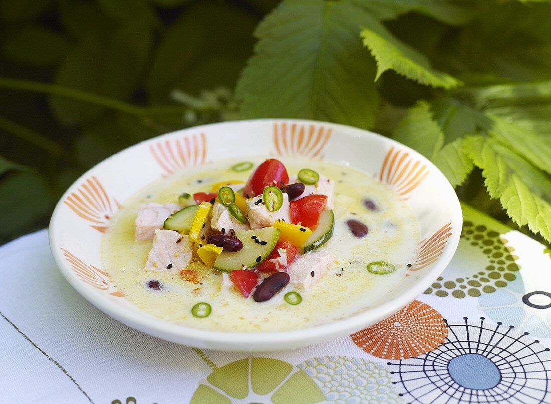 Coconut soup with salmon and vegetables