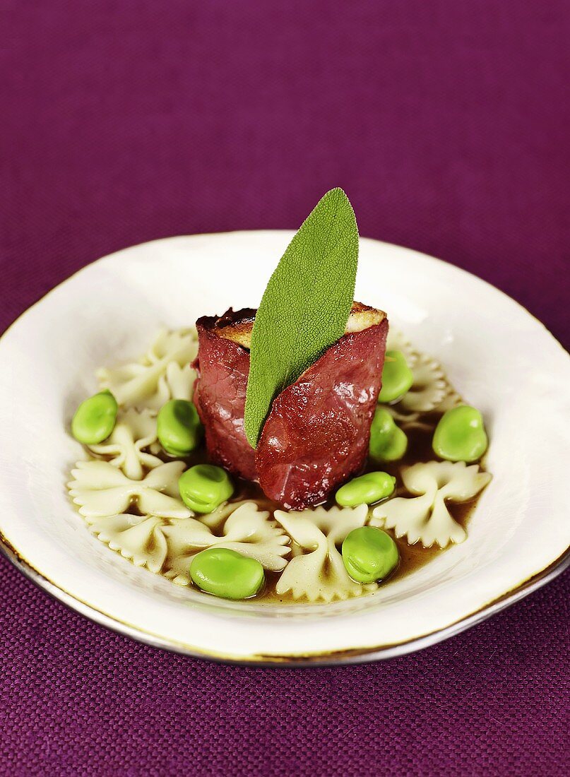 Saltimbocca with farfalle and beans