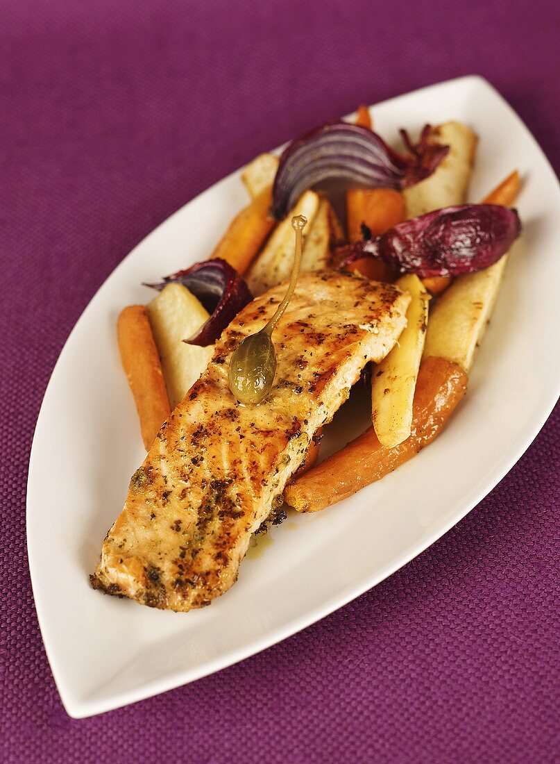 Fried salmon fillet with root vegetables