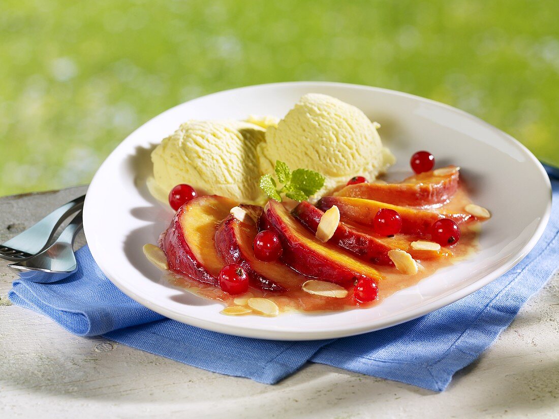 Vanilla ice cream with caramelised peaches, redcurrants & flaked almonds