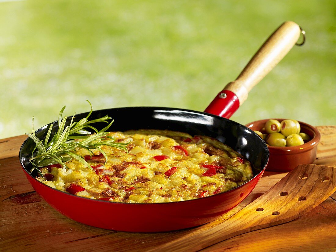 Potato tortilla in frying pan